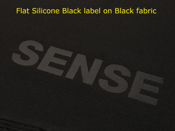 Flat Silicone Black label on Black fabric